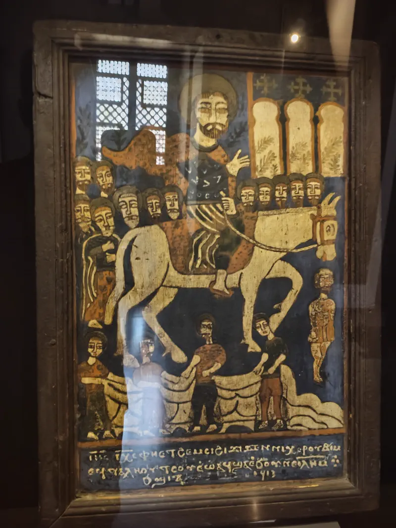 Painted icon detail displayed behind glass in the Coptic Museum