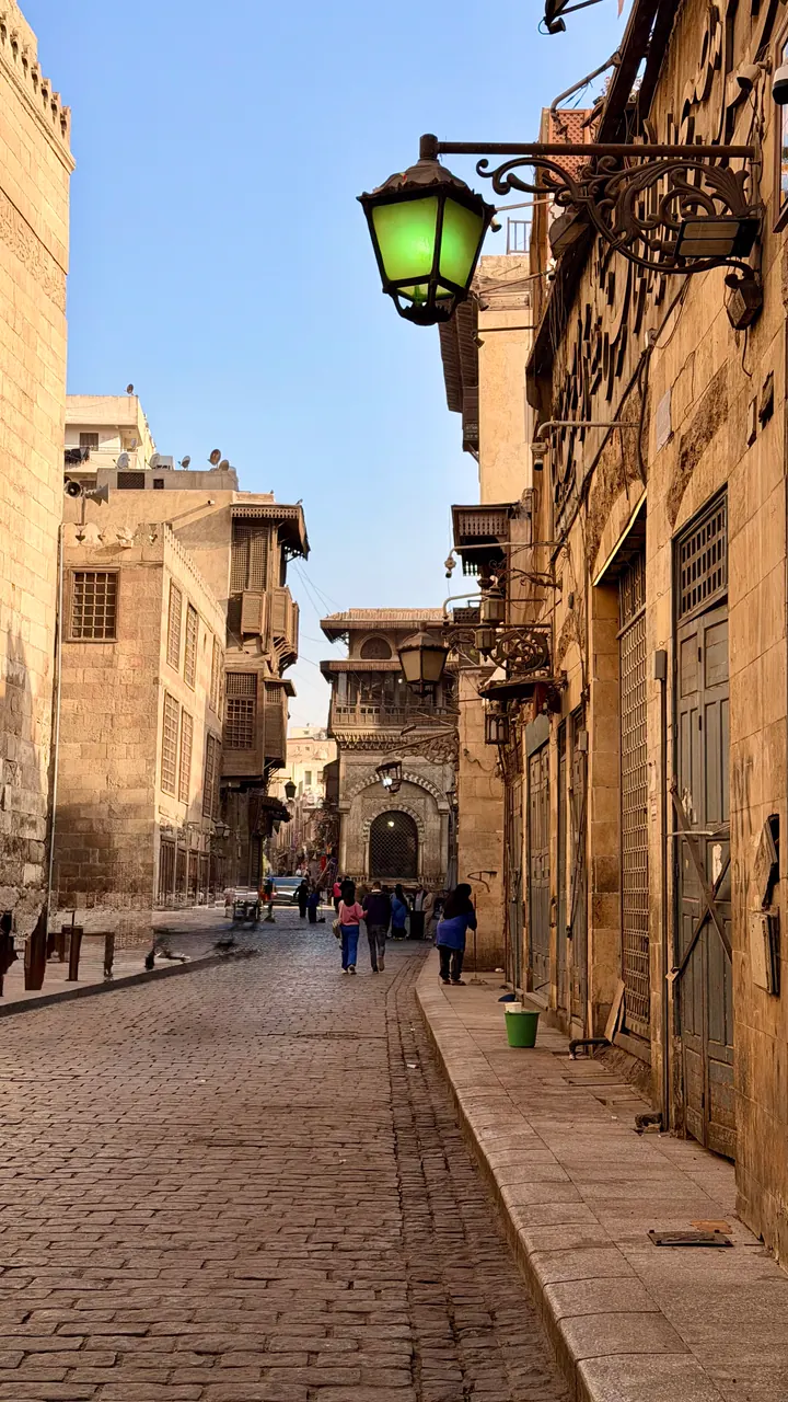 People walking through a Historic Cairo street near Khan el-Khalili