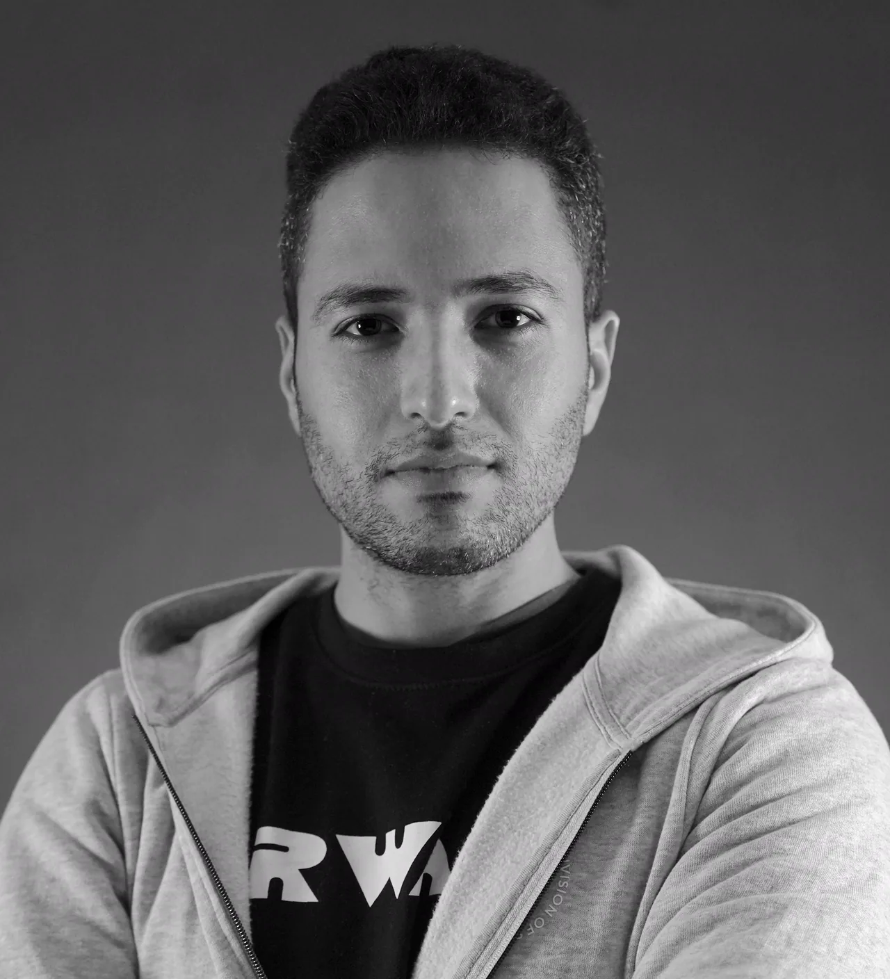 Black-and-white studio portrait of Mersa, filmmaker and editor behind Mersa Productions